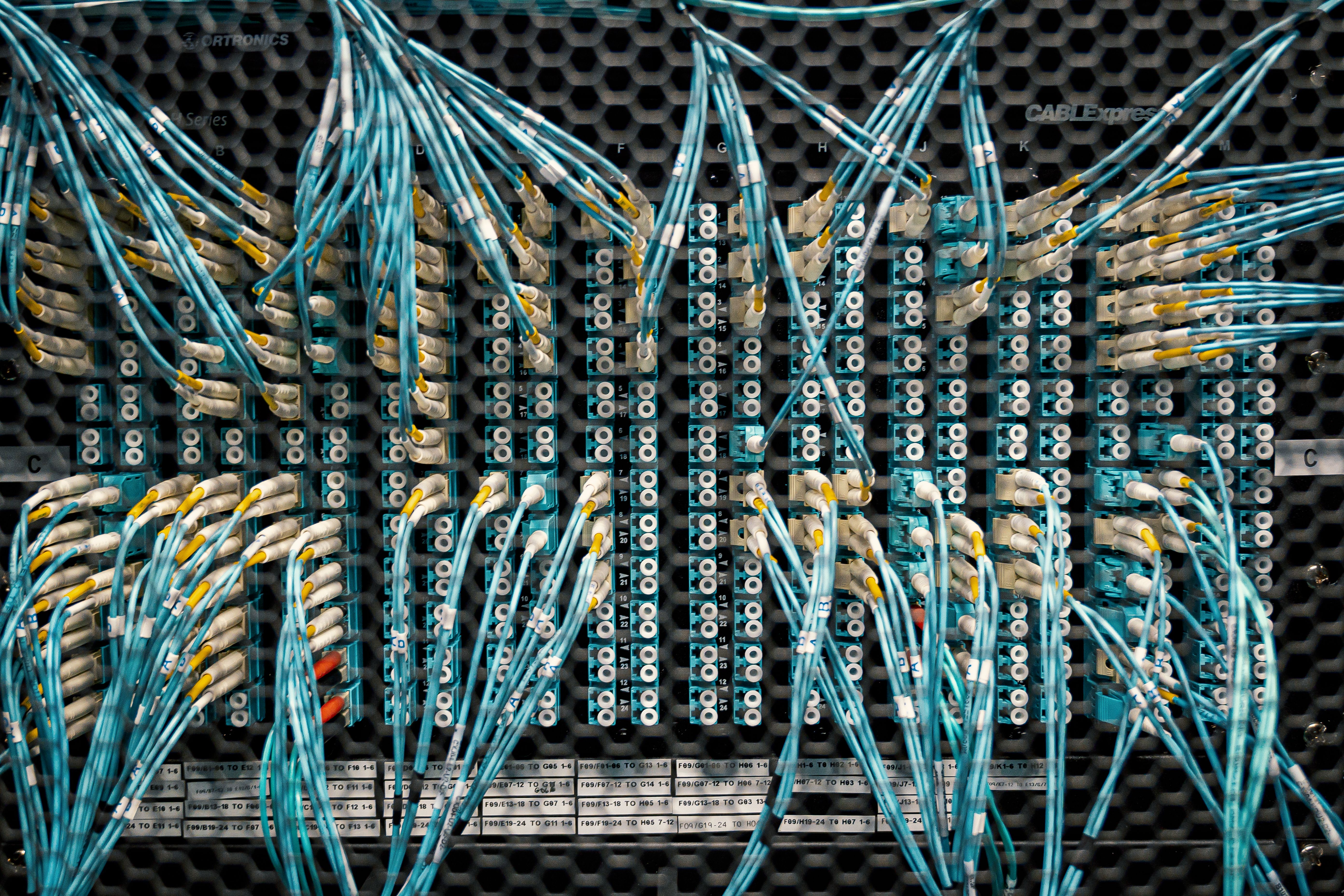 Rows of server racks inside a data centre.